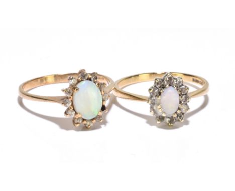 A 9ct yellow gold opal dress ring, size P, and a similar slightly smaller example, also size P (each missing a stone), combin