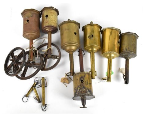 Seven vintage brass spits.