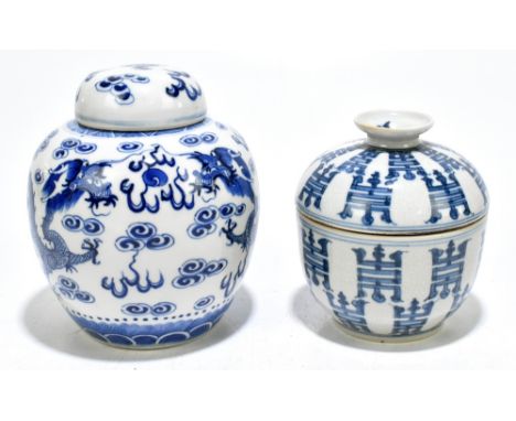 A Chinese Kangxi style blue and white ginger jar and cover, decorated with dragons, height 15cm, with a further Chinese rice 