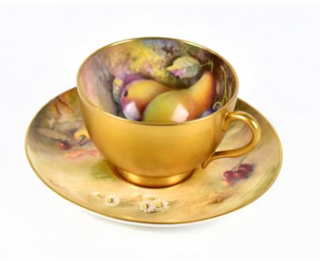 WILLIAM RICKETTS AND THOMAS LOCKYER FOR ROYAL WORCESTER; a hand painted teacup and saucer decorated with fruit, each piece si