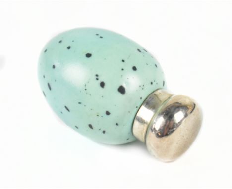 ATTRIBUTED TO MACINTYRE; a mottled pale blue egg shaped scent bottle with silver cap hallmarked London 1885, length 3.7cm.Add