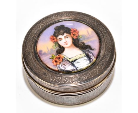 LIMOGES; a French silver circular box, the cover set with an enamelled circular plaque painted with the head and shoulders po