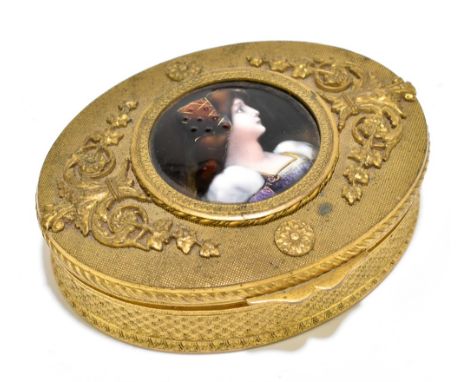 LIMOGES; an oval gilt metal trinket box, the hinged lid centred with a circular enamelled jewelled plaque decorated with the 