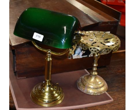 A modern brass desk lamp with rotating green glass shade, with a late 19th century brass trivet (2).