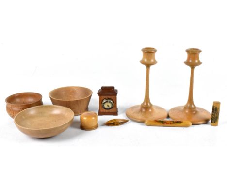 A small collection of late 19th century and later treen to include a Mauchlineware needle case decorated with a view of Llanr