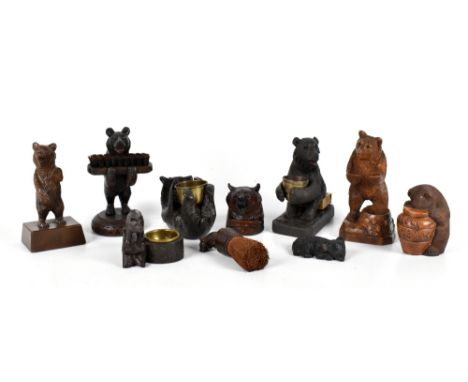 BLACK FOREST; a group of assorted bears including standing brush holder, height 16cm, an example lying down supporting a bras