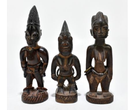 Three fertility figures with ring bead adornments, possibly Ijebu Ode, heights 23.5cm, 22cm and 20cm.Additional InformationGe