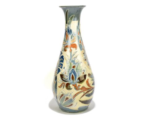 CHARLES BRANNAM; a late 19th century art pottery vase of trumpet vase with floral decoration, height 54cm, signed and dated 1