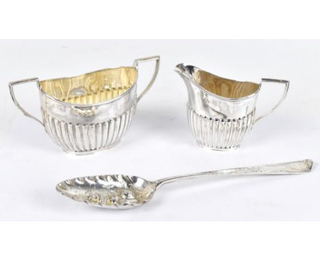 A late Victorian hallmarked silver twin handled sugar bowl with part fluted decoration and matching cream jug, Sheffield 1897