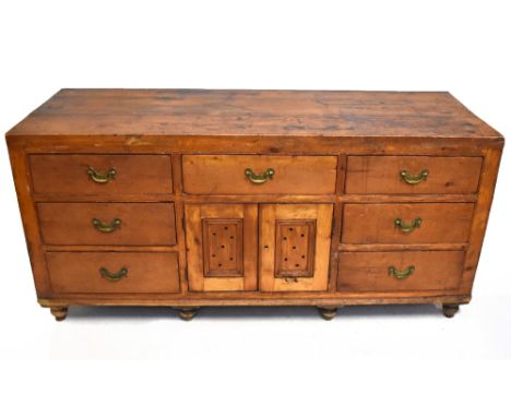 A vintage pine seven drawer dresser.
