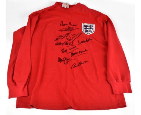 ENGLAND 1966 WORLD CUP WINNERS; a Toff’s England retro style home shirt, signed by Peters, Hurst, J.Charlton, Wilson, Stiles,