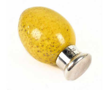 ATTRIBUTED TO MACINTYRE; a small gold flecked mottled yellow glass egg shaped scent bottle with silver cap, hallmarked London
