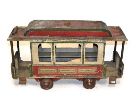Large wooden pull-along passenger Tram car, early 20th century, painted in red, cream and green, hinged roof and bench seatin