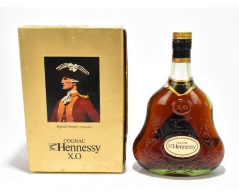 COGNAC; a bottle of Hennessey X.O 68cl, boxed.Additional InformationThe lower part of the cap and the labels are peeling/lift