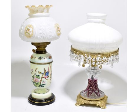 A late 19th century French painted glass oil lamp, with moulded glass shade, height 53cm, together with a gilt metal and cut 