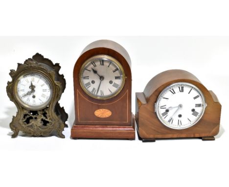 An Edwardian mahogany and inlaid mantel clock with Roman numerals to the silvered dial, height 32cm, a 1940s mantel clock wit