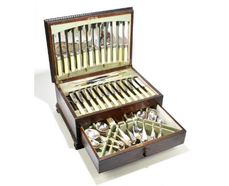 A silver plated canteen of Old English pattern cutlery, the knives with ivorine handles and stainless steel blades, in an oak