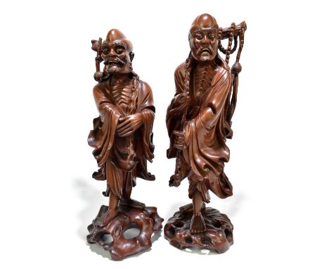 Two large late 19th century Chinese rootwood figures of immortals, height of larger 43cm (2).


PLEASE NOTE: we are unable to