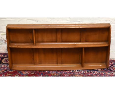 ERCOL; an elm hanging shelf with stepped arrangement, width 107cm.