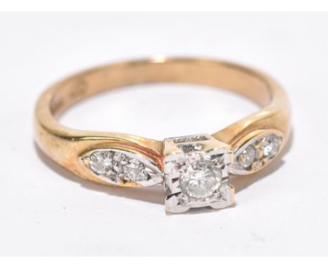 A 9ct yellow gold illusion set dress ring, set with central diamond and diamond chips to shoulders, approximate size K, appro