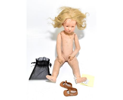 CATHE KRUSE; a doll with composition head and cloth body, the underside of the left foot with printed signature in red and no