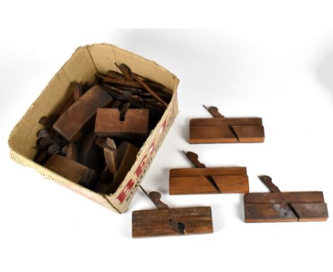 A group of vintage wood working planes including beech moulding planes.
