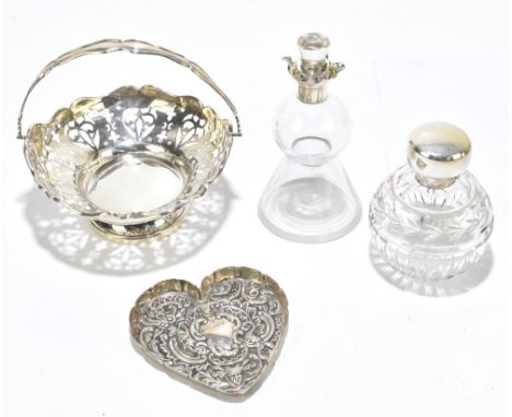 An Edwardian pierced hallmarked silver basket, Birmingham 1911, with an embossed silver heart shaped tray, a hallmarked silve
