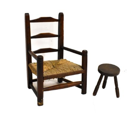 An early 20th century elm rush seated ladder back children's armchair, height 52cm, width 34cm, with a small milking stool (2
