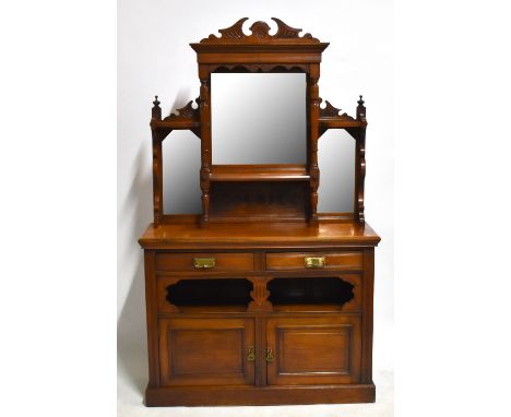 &nbsp;A Victorian carved walnut mirrored back sideboard, the back with three mirrored panels above two drawers, fixed shelf a