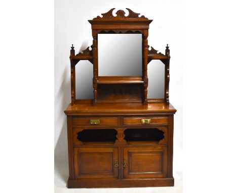 &nbsp;A Victorian carved walnut mirrored back sideboard, the back with three mirrored panels above two drawers, fixed shelf a