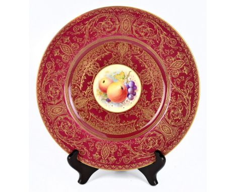 ROYAL WORCESTER; a modern cabinet plate with gilt heightened broad border on a crimson ground with central fruit painted circ