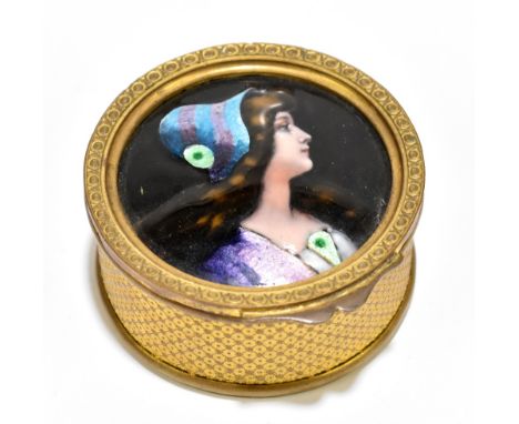 LIMOGES; a circular gilt metal trinket box, the hinged lid set with an circular enamel plaque painted with the head and shoul