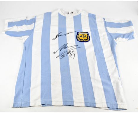 DIEGO MARADONA &amp; LIONEL MESSI; a 1986 retro Argentina shirt, signed to the front, 3XL.Additional InformationCreasing and 