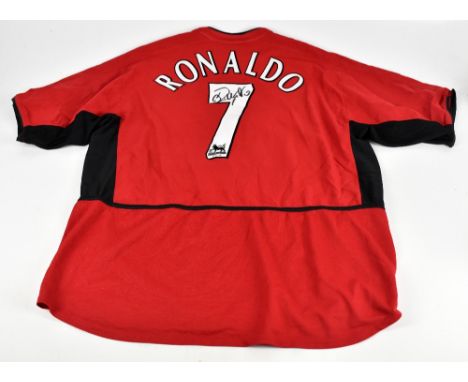 CRISTIANO RONALDO; a Nike Manchester United 2002-2004 home shirt, signed to reverse, size XXL.
Additional InformationCreasing