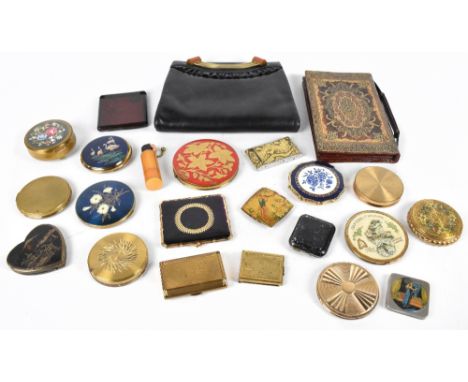 A grouping of assorted vintage lady's compacts including an Art Deco example with engine turned decoration, an amber effect c