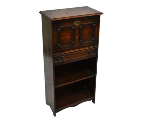 An early 20th century oak student's bureau, with fall front above drawer and shelf, width 53cm, depth 30cm, height 108cm.