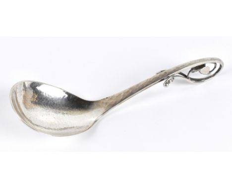 EMIL SNEDKER; an 830 grade ladle with planished decoration and pierced floral handle, length 16cm, apprxox. 1.7ozt/54g.Additi