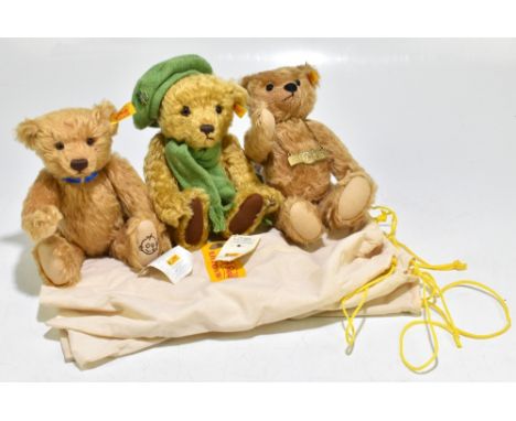 STEIFF; three medium size teddy bears, one a 2002 bear, one with an Irish green scarf and beret, the other celebrating 100 ye