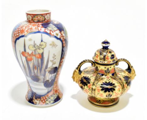 DERBY; a 19th century floral decorated gilt heightened cobalt blue ground twin handled vase and cover with moulded masks to t