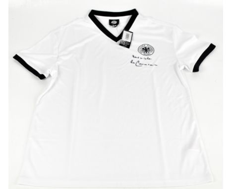 FRANZ BECKENBAUER; a retro Germany shirt, signed to front, size L.
Additional InformationCreasing and light general wear, no 