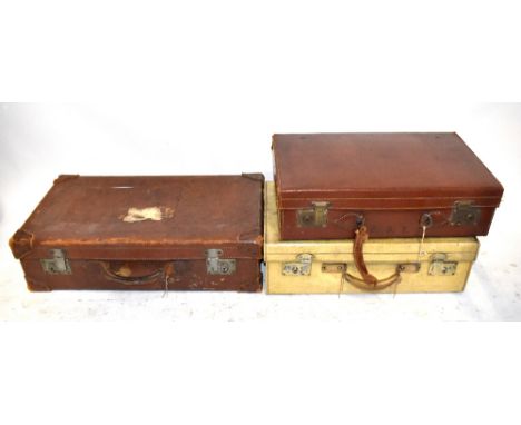 Three vintage suitcases including a vellum example, width of largest 66cm.
