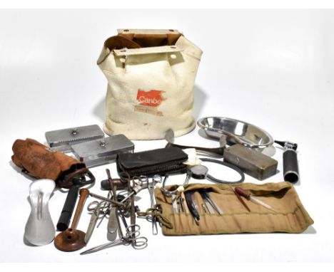 A bag containing an assortment of dentist's equipment and accessories including metal dishes, a lidded jar stamped 'Fitzwell'