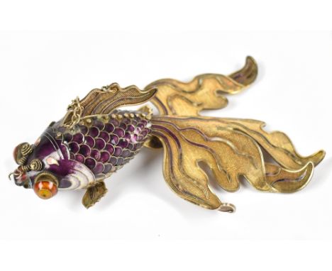 A gilt white metal and enamelled reticulated fish, stamped silver, length 17cm.Additional InformationMissing one of the fins 