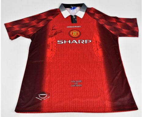 ERIC CANTONA; an Umbro Manchester United 1996-1998 season retro reproduction home shirt, signed to front, size XL.
Additional