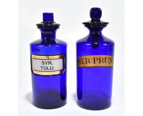 Two blue glass apothecary/chemists jars, the older with a label for Syr: Prun: V:, the other with the label for Syr.Tolu., wi