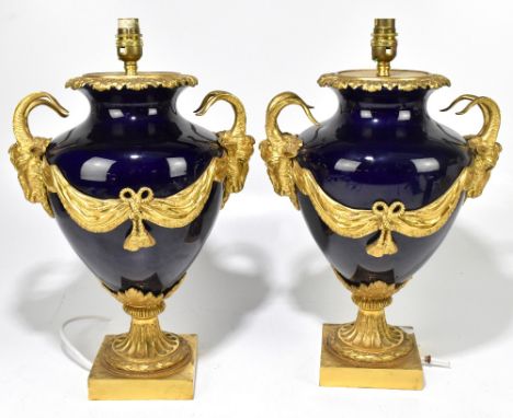 A pair of highly decorative 19th century style twin handled ceramic table lamps with ormolu mounts and handles, height exclud