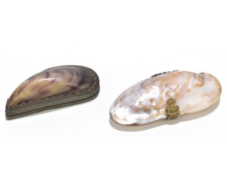 A pewter mounted mussel shell snuff box, length 8.5cm, with a similar purse in the form of a shell, length 11cm (2).Additiona