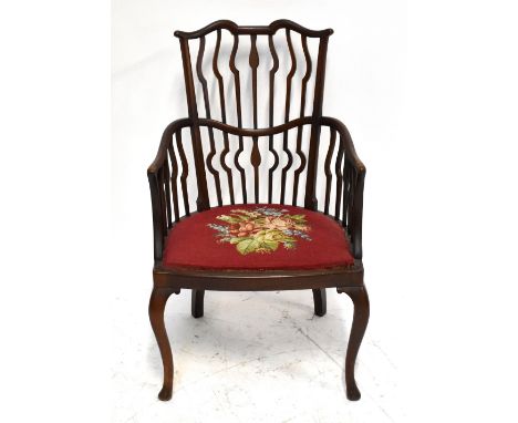 An Edwardian mahogany salon chair of 18th century style, with tapestry seat on cabriole legs, height 95cm.Additional Informat