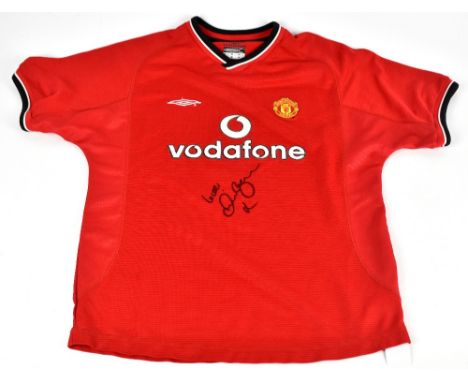 DAVID BECKHAM; an Umbro Manchester United 2000 shirt, signed to the front, size LB.Additional InformationCreasing and light g