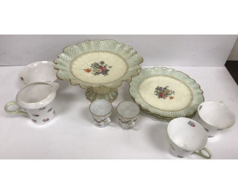 A Shelley part tea set comprising sugar bowl, milk jug, two cups, five saucers, six tea plates and a sandwich/cake plate, a s
